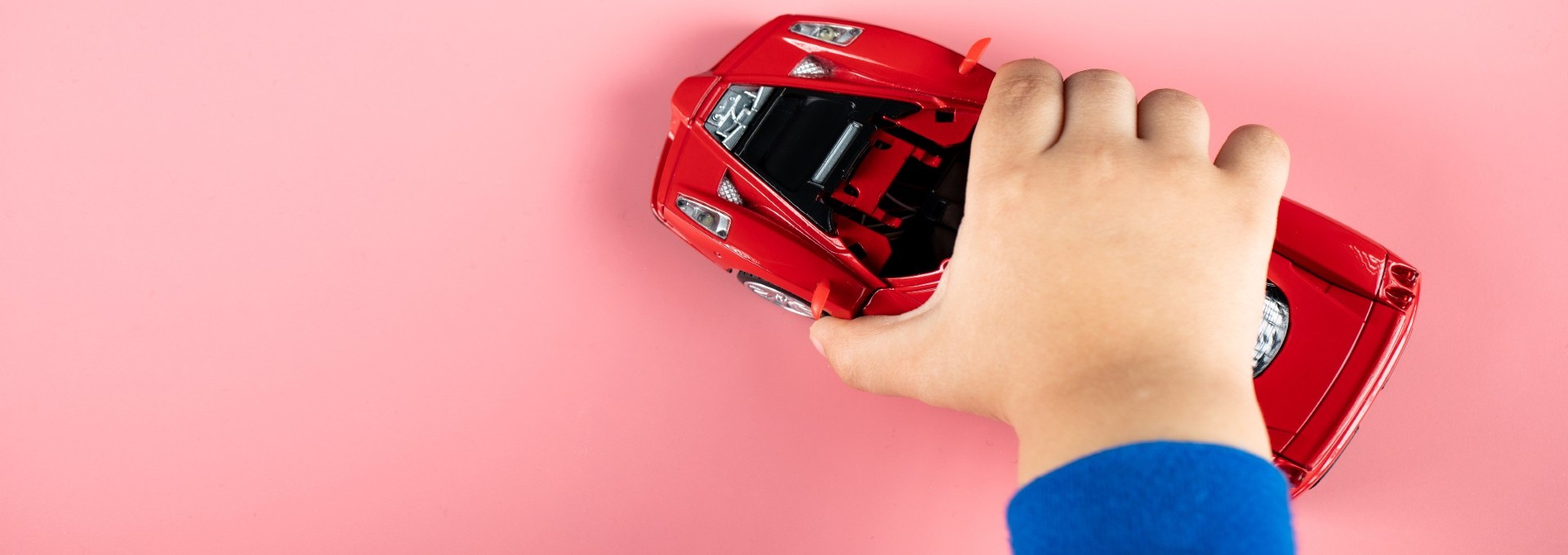 small-red-car-toy-kid-child-playing-with-it new